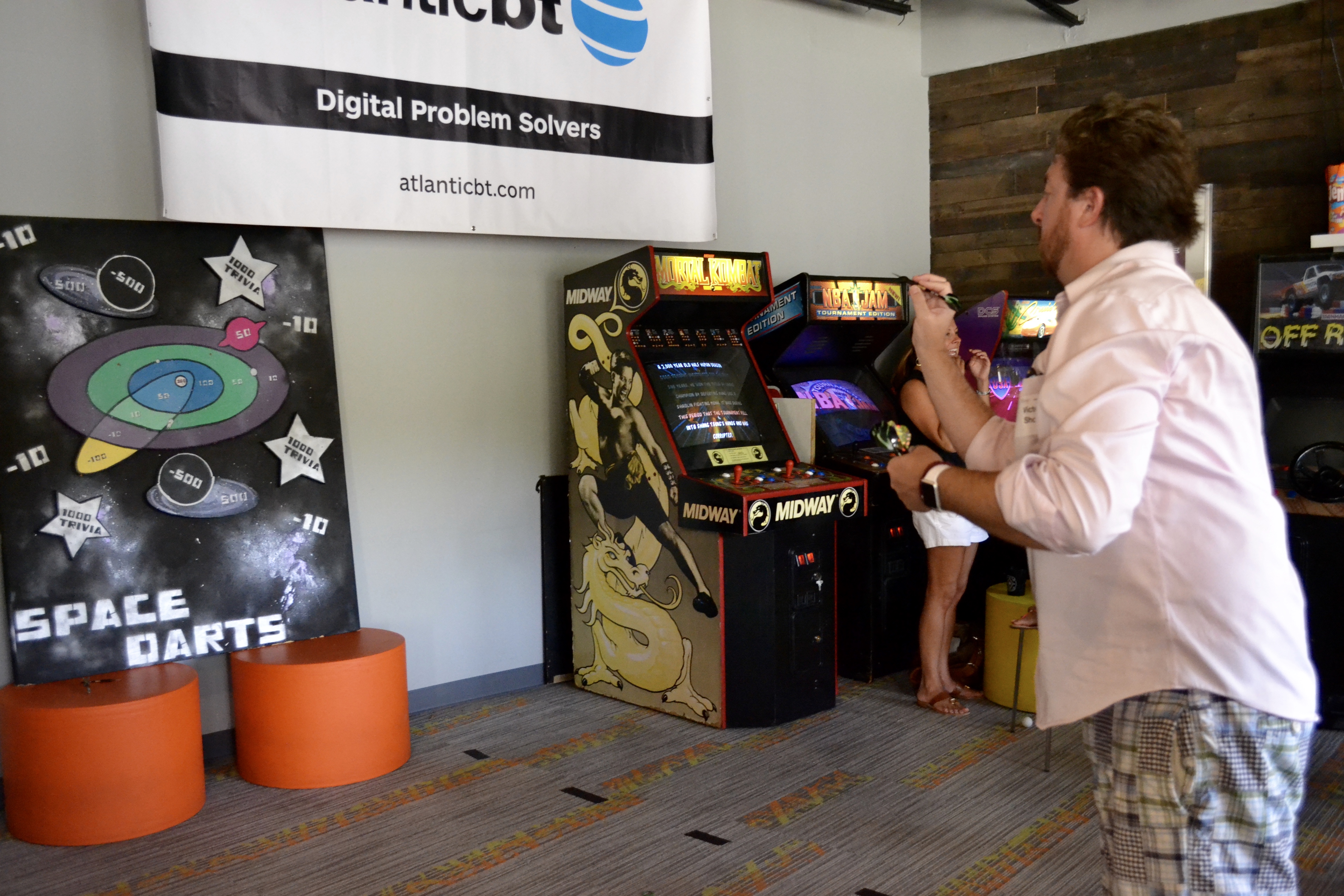 AtlanticBT employee playing custom dart game