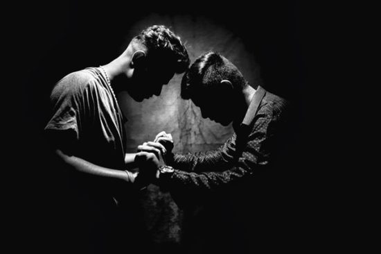 two men facing off in black and white